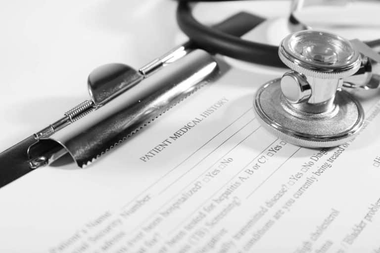 A stethoscope and medical form - Third Class Medical Requirement to be Removed
