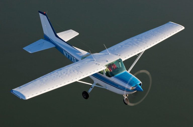 Cessna 172 in flight over the water - Learning to Fly With the Slovenly Pig