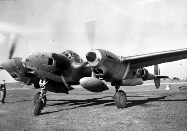 Antoine de Saint-Exupéry aboard his airplane