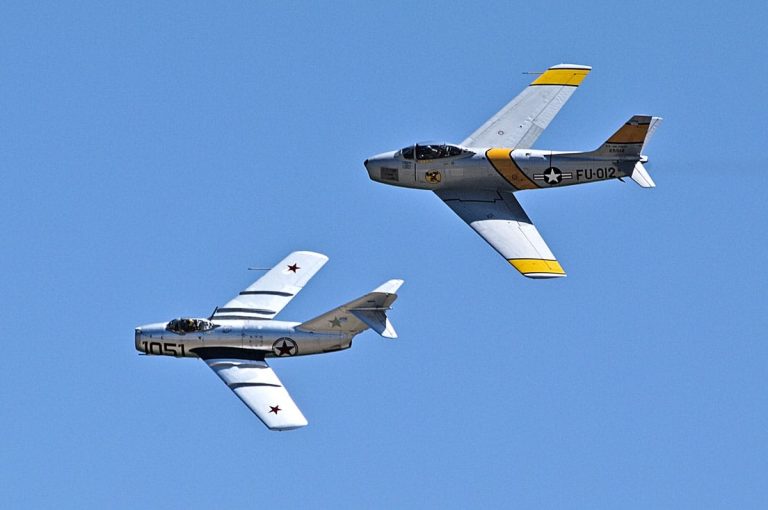 A MiG-15 and F-86 airplane flying together - The Korea Files 6: The Gun Camera
